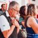 A diverse group of adults in prayer inside a church, expressing spirituality and devotion.