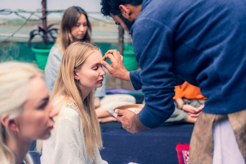 Group meditation and spiritual practice scene with focus on shared rituals and mindfulness.
