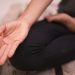 Close-up of a hand in a meditation pose, focusing on mindfulness and calmness.