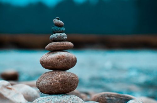 A peaceful arrangement of stacked stones in a natural setting, capturing tranquility in Batabari, India.