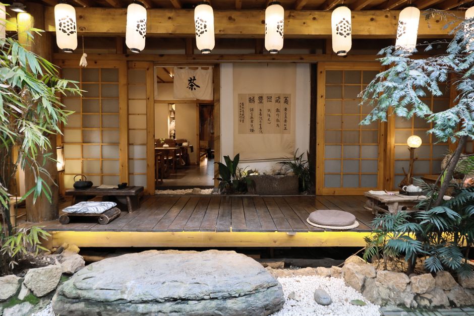 Serene Japanese tea room with lanterns and traditional decor, ideal for meditation and cultural appreciation.